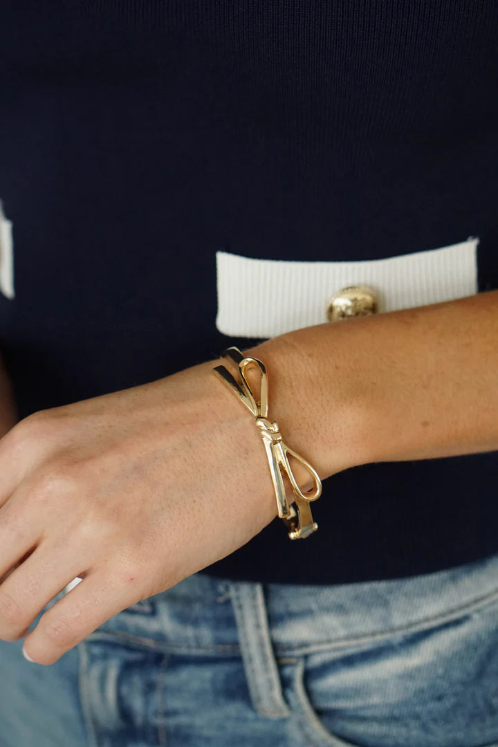 Karina Bow Wrapped Hinge Bangle in Shiny Gold